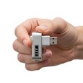 Compact portable usb ethernet adapter held in a hand for easy data transfer Royalty Free Stock Photo
