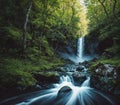 A beautiful waterfall in the middle of a lush green forest. Royalty Free Stock Photo