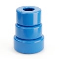 Bright blue cylindrical connector with a central hole and ribbed texture on the base Royalty Free Stock Photo