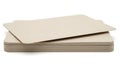 Stack of beige cardboard sheets on white background Royalty Free Stock Photo