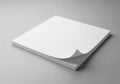 A neatly arranged stack of blank white paper on a gray surface Royalty Free Stock Photo