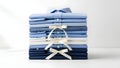 Stack of neatly folded light and dark blue folded fabrics with ribbon closure Royalty Free Stock Photo