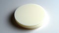 A stack of three white, circular objects. Royalty Free Stock Photo