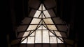 Low angle view of stained glass window with a geometric design