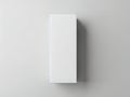A tall white rectangular box standing upright against a plain background Royalty Free Stock Photo