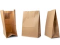 Three brown paper bags displayed against a white background, varying in orientation Royalty Free Stock Photo