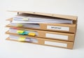 Three cardboard file boxes filled with various documents and a yellow sticky note Royalty Free Stock Photo