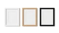 Three empty picture frames in different colors displayed side by side isolated on white background Royalty Free Stock Photo