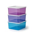 Stacked transparent plastic containers with snap-on lids in different colors Royalty Free Stock Photo