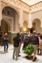 Tourist viewing the Islamic architecture of the Alcazar in Seville, Spain