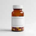 A brown bottle filled with various colored capsule pills and a white label Royalty Free Stock Photo