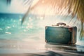 Travel suitcase resting on a tropical beach surrounded by palm leaves and blue sea