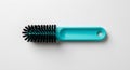 turquoise brush with black bristles on white Royalty Free Stock Photo