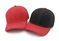 Two baseball caps displayed side by side isolated on white background Royalty Free Stock Photo
