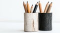 A set of pencils in two different colored wooden holders. Royalty Free Stock Photo