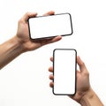 Two hands holding smartphones with blank screens side by side Royalty Free Stock Photo