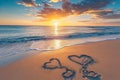 The image shows two hearts drawn in the sand on a beach, with the waves crashing in the background, A beautiful sunrise over a Royalty Free Stock Photo