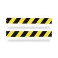 Two horizontal caution tape barriers with black and yellow stripes set against a plain background Royalty Free Stock Photo