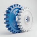 Interlocking blue and white industrial gears in mechanical alignment Royalty Free Stock Photo