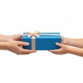 Two hands exchanging a beautifully wrapped gift box with a decorative bow Royalty Free Stock Photo