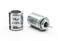 Two views of a 10 microfarad, 50 volt cylindrical capacitor component Royalty Free Stock Photo