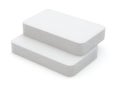 Two white foam blocks stacked on top of each other against a white background Royalty Free Stock Photo