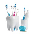 Creative tooth-shaped holder with dental care accessories and toothpaste Royalty Free Stock Photo
