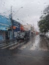 Raindrops on Car Window with Street View Royalty Free Stock Photo