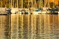 Oslo - fjord, boats and waves at golden sunset.