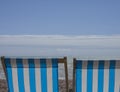 Brighton, England, the UK - beach chairs and blue skies. Royalty Free Stock Photo