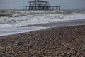 West Pier, Brighton, England - the waves and the beach. Royalty Free Stock Photo