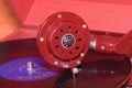 Image shows vintage gramophone famous Czech brand Supraphone. The red wind-up gramophone and vinyl record brand Ultraphon.