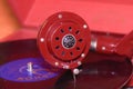 Image shows vintage gramophone famous Czech brand Supraphone. The red wind-up gramophone and vinyl record brand Ultraphon.