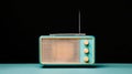 A vintage turquoise radio with a white antenna sits on a black background. Royalty Free Stock Photo