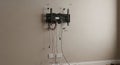 tv mount installation on wall with exposed cables Royalty Free Stock Photo