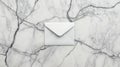 A white envelope on a marble surface. Royalty Free Stock Photo