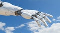 A robotic hand reaching towards the sky. Royalty Free Stock Photo