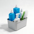Organized cleaning supplies neatly arranged in a white utility caddy Royalty Free Stock Photo