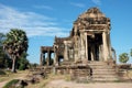 Image of a single ancient stone structure in the famous abandoned Khmer city of Angkor on a sunny day