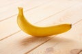 Image of single Banana on wooden table Royalty Free Stock Photo