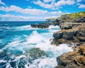 large body of water with a cliff in the distance waves slamming the rocks.