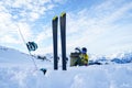 Image of skis, ski poles against background of two sports women with thermos sitting in ski resort in winter. Royalty Free Stock Photo