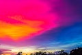 The image of the sky is light pink interspersed with dark blue. In the evening, near dusk, clouds obscured the gloomy sunlight. Royalty Free Stock Photo