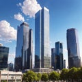 Skyscraper glass facades on a bright sunny day with sunbeams in the blue sky. Modern buildings in Paris Royalty Free Stock Photo