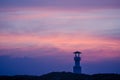 Image of small lighthouse against a tropical ocean sunset and smooth water at Khao Lak Beach in Phang Nga,Thailand. Royalty Free Stock Photo