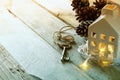 Image of small miniature house and old key over rustic wooden table. filtered and toned Royalty Free Stock Photo