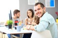 Image of smart young businessmen looking at camera