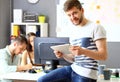 Image of smart young businessmen looking at camera