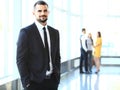 Image of smart young businessmen looking at camera