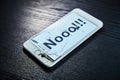 Image of smartphone with broken screen and the word Nooo!!! on it Royalty Free Stock Photo